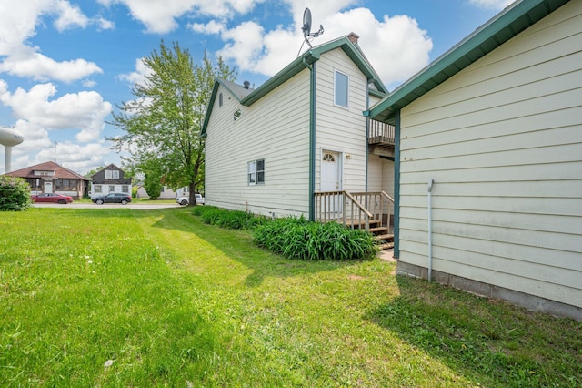 11 1st St, Nashwauk, MN 55769 - view of green lawn with a balcony