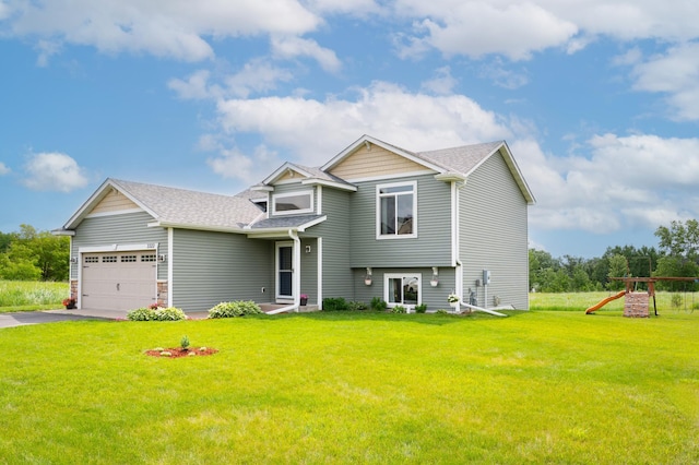 3322 Orchard Ave NE, Sauk Rapids, MN 56379 - view of front of home featuring a front yard, driveway, a shingled roof, an attached garage, and a playground