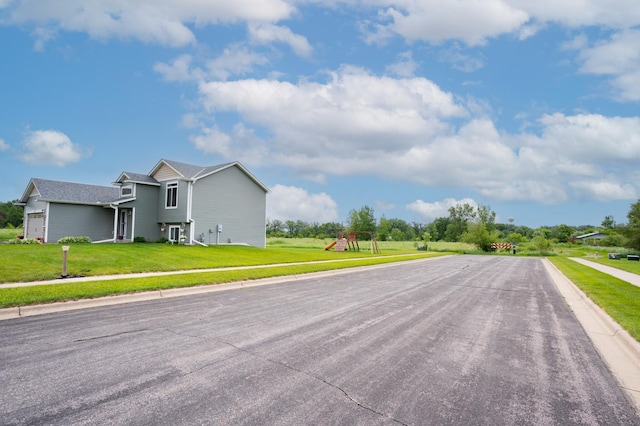 3322 Orchard Ave NE, Sauk Rapids, MN 56379 - view of asphalt road with sidewalks and curbs