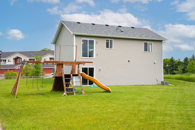 3322 Orchard Ave NE, Sauk Rapids, MN 56379 - rear view of house featuring a playground and roof with shingles