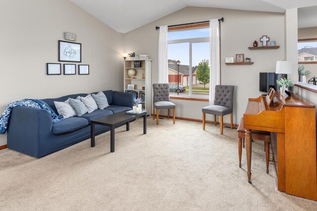 3322 Orchard Ave NE, Sauk Rapids, MN 56379 - living area featuring lofted ceiling, carpet floors, and baseboards