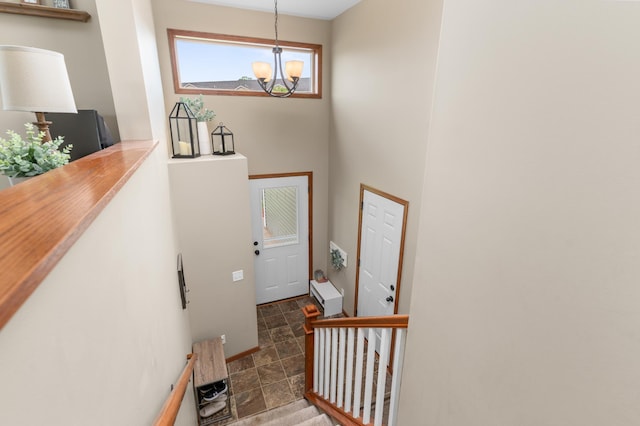 3322 Orchard Ave NE, Sauk Rapids, MN 56379 - staircase with a chandelier and stone finish flooring