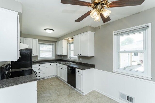 912 11 1/2 St SW, Rochester, MN 55902 - kitchen featuring black appliances, dark countertops, a ceiling fan, and white cabinetry