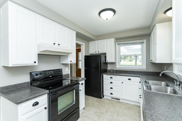 912 11 1/2 St SW, Rochester, MN 55902 - kitchen featuring black appliances, under cabinet range hood, white cabinets, and dark countertops