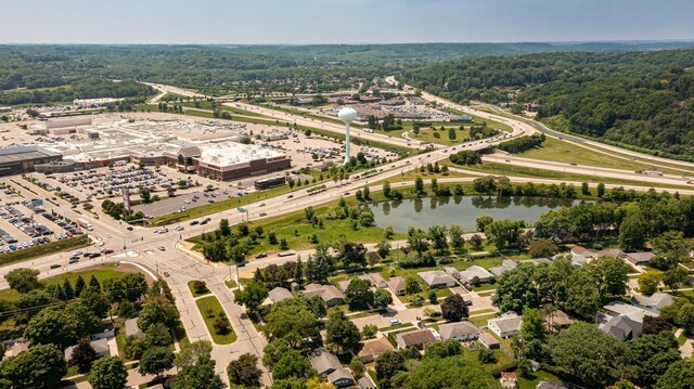 912 11 1/2 St SW, Rochester, MN 55902 - drone / aerial view of a nearby body of water and a heavily wooded area