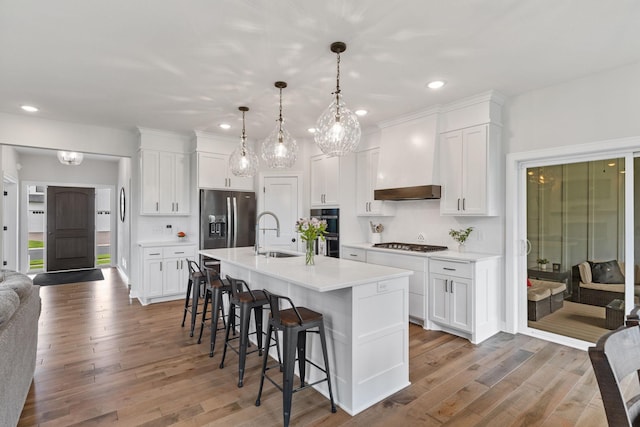 14960 143rd Ave N, Dayton, MN 55327 - kitchen with stainless steel appliances, a sink, a kitchen breakfast bar, white cabinets, and light countertops