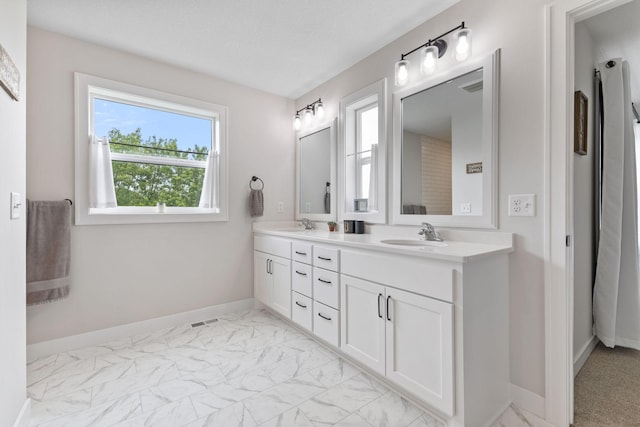 14960 143rd Ave N, Dayton, MN 55327 - full bathroom with double vanity and marble look tile flooring