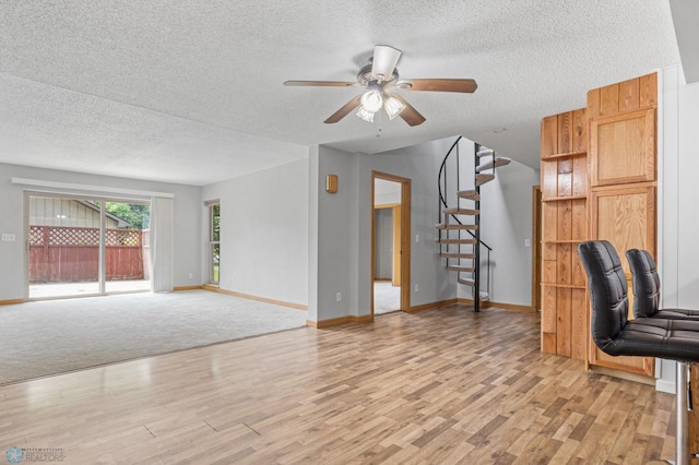 1301 5th Ave N, Moorhead, MN 56560 - unfurnished office with a textured ceiling, light wood-type flooring, and a ceiling fan