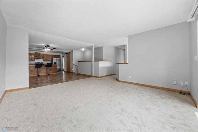 1301 5th Ave N, Moorhead, MN 56560 - unfurnished living room with carpet and a ceiling fan