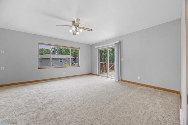 1301 5th Ave N, Moorhead, MN 56560 - carpeted empty room featuring a ceiling fan and baseboards