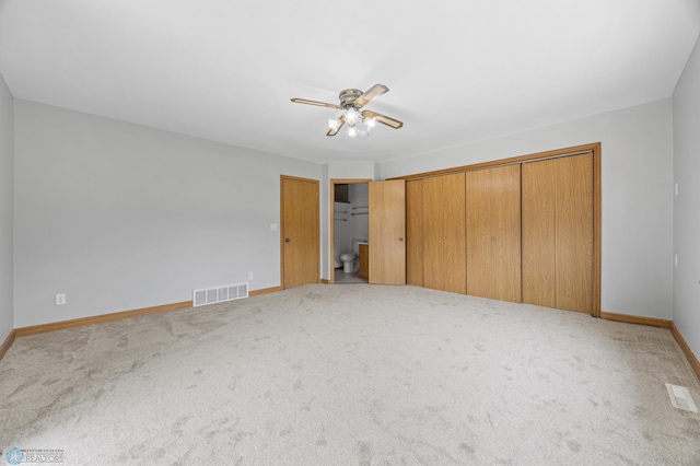 1301 5th Ave N, Moorhead, MN 56560 - unfurnished bedroom with carpet and ceiling fan