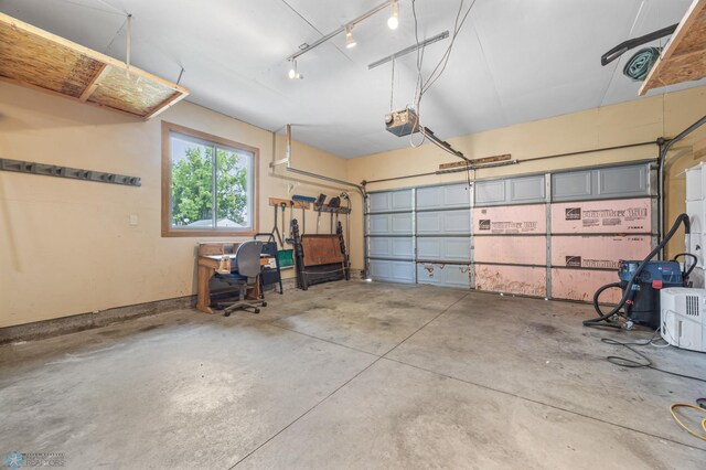 1301 5th Ave N, Moorhead, MN 56560 - garage featuring a garage door opener