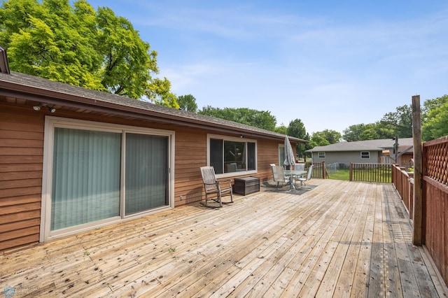 1301 5th Ave N, Moorhead, MN 56560 - wooden deck with outdoor dining area