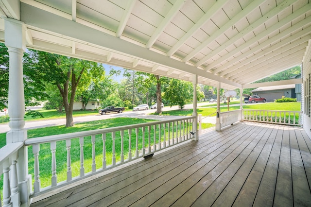 741 3rd St NE, Faribault, MN 55021 - wooden porch with a lawn