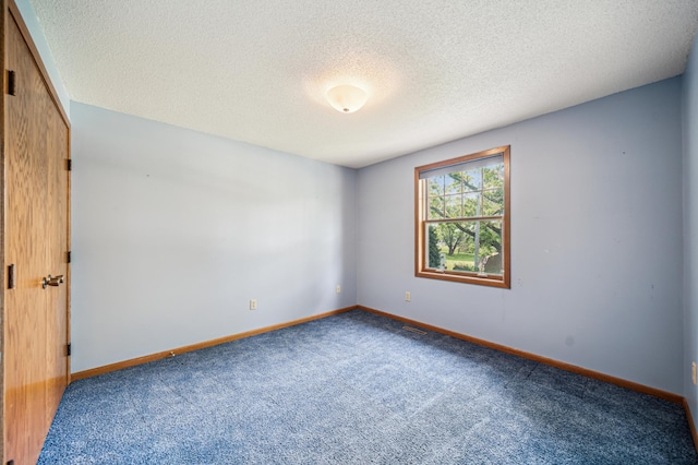 741 3rd St NE, Faribault, MN 55021 - empty room with carpet flooring and a textured ceiling