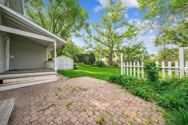 741 3rd St NE, Faribault, MN 55021 - view of patio with a shed and a deck