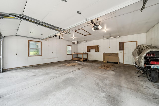 741 3rd St NE, Faribault, MN 55021 - garage featuring a garage door opener