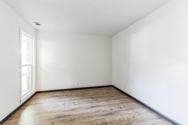 6417 Colony Way Unit 2A, Edina, MN 55435 - unfurnished room with plenty of natural light, light wood-type flooring, and baseboards