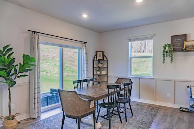 882 Redmond Dr, Carver, MN 55315 - dining room with wood finished floors, wainscoting, recessed lighting, and a decorative wall