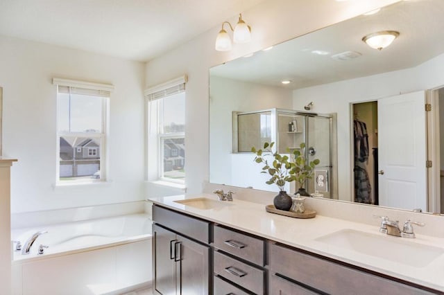 882 Redmond Dr, Carver, MN 55315 - bathroom with double vanity, a shower stall, a bath, and a walk in closet