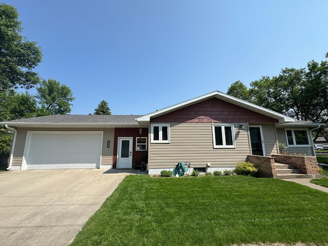 401 5th St NE, Barnesville, MN 56514 - ranch-style home featuring a front yard, driveway, and an attached garage