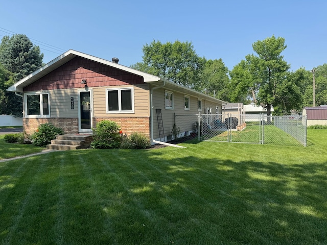 401 5th St NE, Barnesville, MN 56514 - view of front of house with a gate and brick siding
