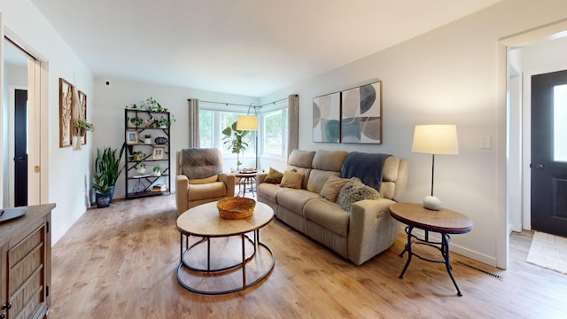 401 5th St NE, Barnesville, MN 56514 - living area featuring light wood finished floors and baseboards