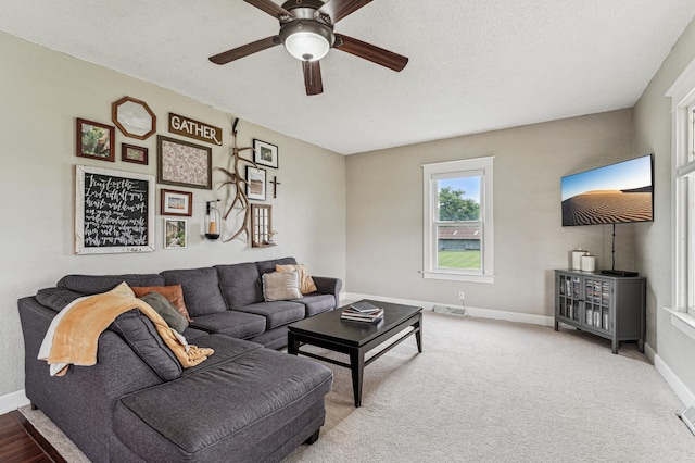 18160 Echo Ave, Faribault, MN 55021 - carpeted living room with a ceiling fan and a textured ceiling