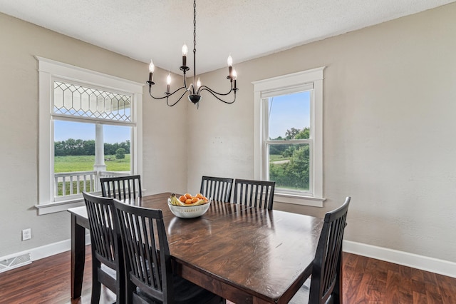 18160 Echo Ave, Faribault, MN 55021 - dining area featuring plenty of natural light, a chandelier, wood finished floors, and a textured ceiling