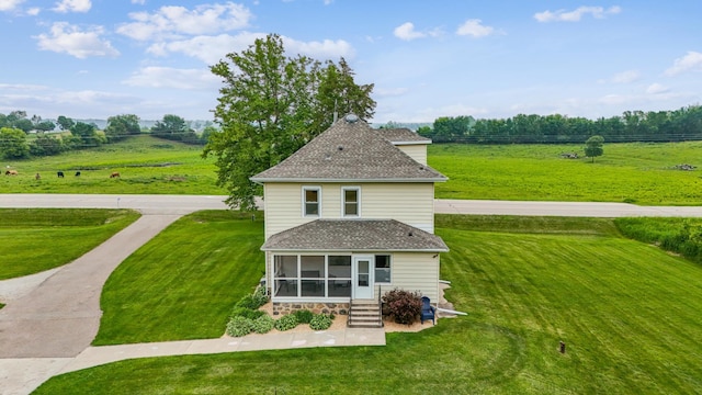 18160 Echo Ave, Faribault, MN 55021 - view of home's exterior with roof with shingles, a lawn, a sunroom, and a view of countryside