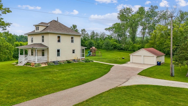 18160 Echo Ave, Faribault, MN 55021 - view of property exterior featuring a porch, a garage, an outdoor structure, roof with shingles, and a lawn