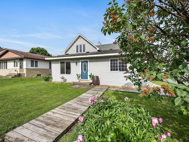 45 Oak Ave S, Maple Lake, MN 55358 - view of front of home with a front lawn and a shingled roof