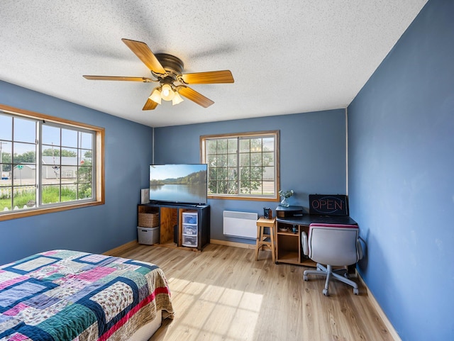 45 Oak Ave S, Maple Lake, MN 55358 - bedroom featuring a textured ceiling, wood finished floors, and ceiling fan