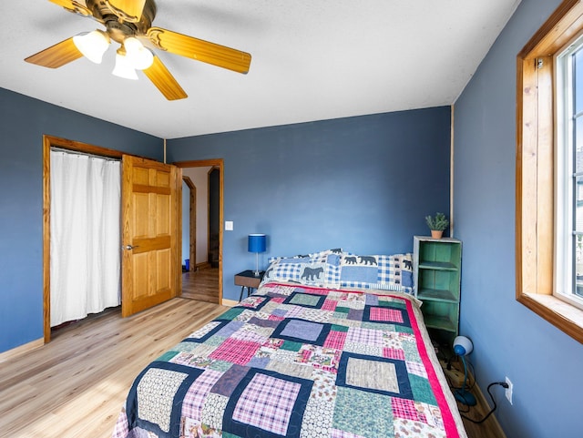 45 Oak Ave S, Maple Lake, MN 55358 - bedroom featuring wood finished floors, multiple windows, and ceiling fan