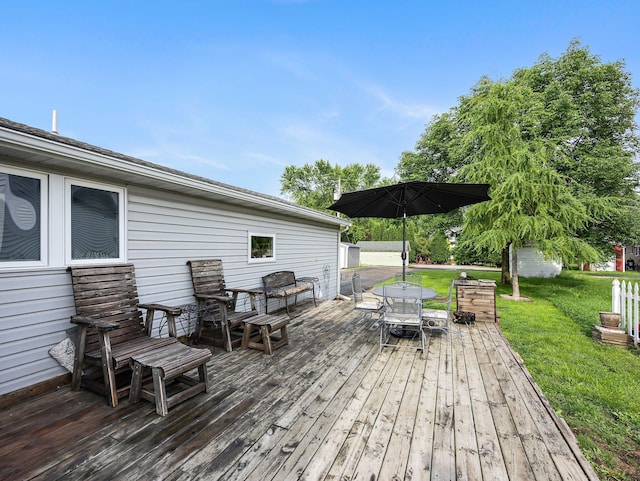 45 Oak Ave S, Maple Lake, MN 55358 - wooden terrace with outdoor dining area and a lawn