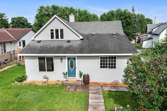 45 Oak Ave S, Maple Lake, MN 55358 - view of front of home featuring roof with shingles, a front yard, and a chimney