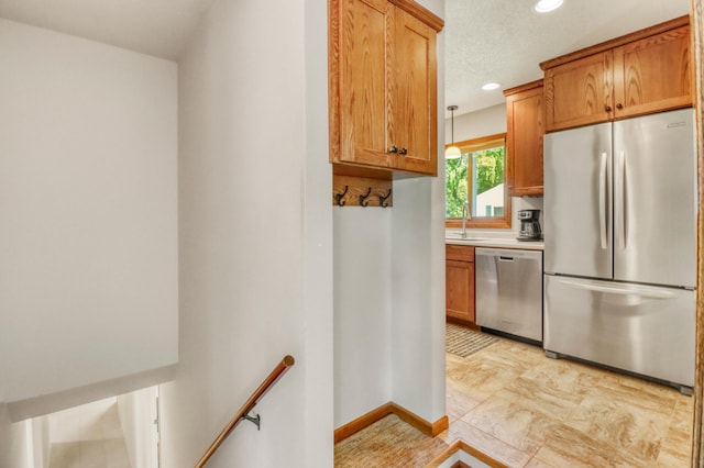 1204 20th Ave S, Moorhead, MN 56560 - kitchen featuring appliances with stainless steel finishes, recessed lighting, brown cabinetry, and light countertops