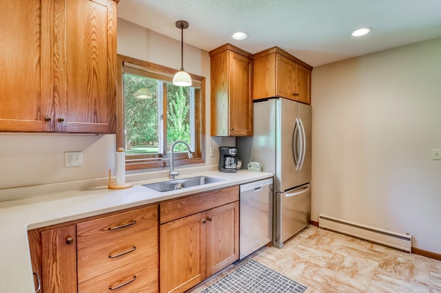 1204 20th Ave S, Moorhead, MN 56560 - kitchen featuring a baseboard radiator, appliances with stainless steel finishes, pendant lighting, light countertops, and brown cabinetry