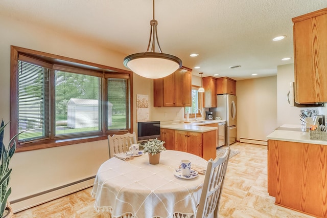 1204 20th Ave S, Moorhead, MN 56560 - dining space with baseboard heating, a baseboard radiator, and recessed lighting
