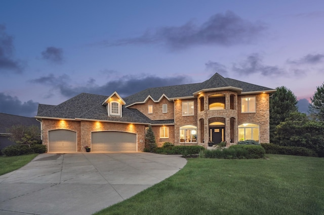 3287 Norcrest Ave N, Baytown Twp, MN 55082 - french country style house featuring a garage, concrete driveway, a front yard, brick siding, and a shingled roof
