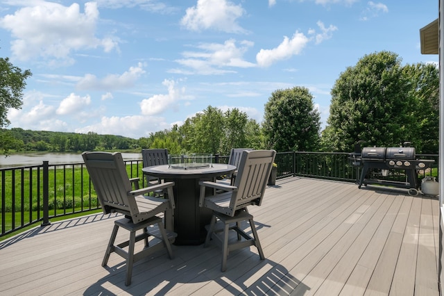 3287 Norcrest Ave N, Baytown Twp, MN 55082 - wooden deck with outdoor dining area, a grill, and a water view