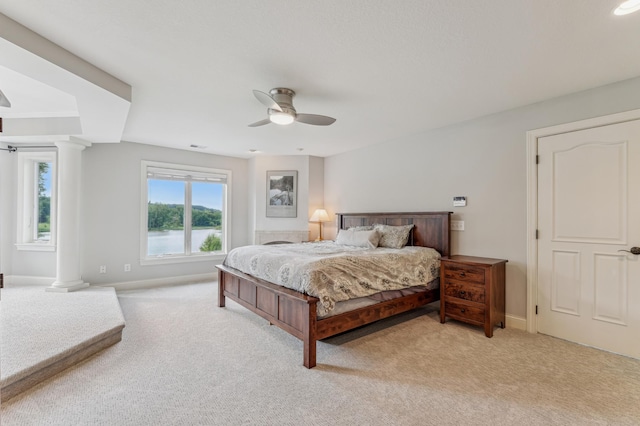 3287 Norcrest Ave N, Baytown Twp, MN 55082 - bedroom with light colored carpet, decorative columns, and a ceiling fan