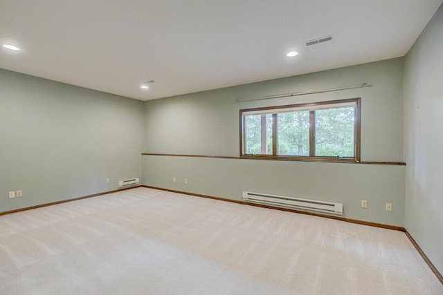 1994 80th St, Somerset, WI 54025 - carpeted spare room with baseboard heating, recessed lighting, baseboards, and a baseboard radiator
