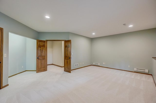 1994 80th St, Somerset, WI 54025 - empty room with baseboard heating, light carpet, baseboards, and recessed lighting