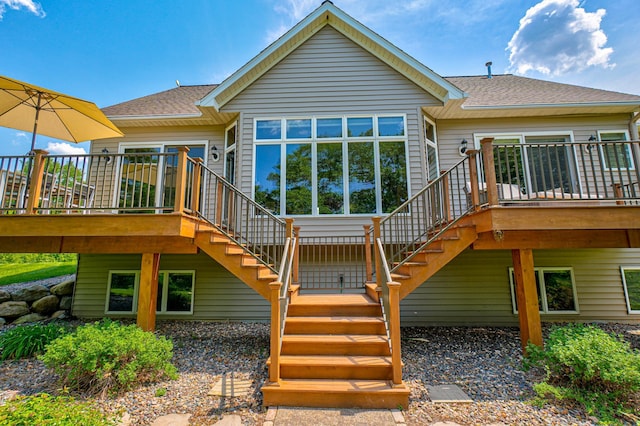 1994 80th St, Somerset, WI 54025 - back of property featuring stairway, a wooden deck, and roof with shingles