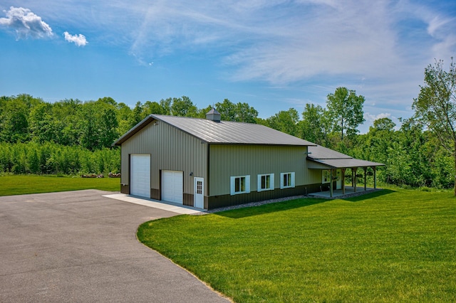 1994 80th St, Somerset, WI 54025 - view of home's exterior with a garage, a yard, and metal roof