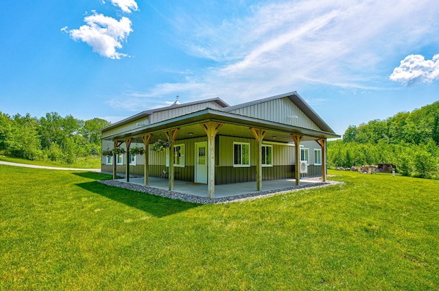 1994 80th St, Somerset, WI 54025 - back of house with a patio area, a lawn, and board and batten siding