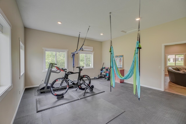 1994 80th St, Somerset, WI 54025 - exercise room with baseboards, recessed lighting, carpet flooring, and a wall mounted AC