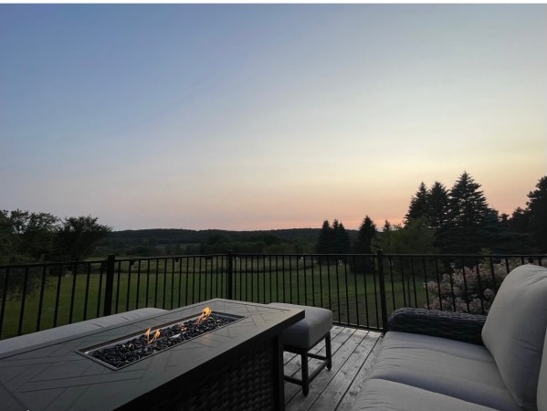 30667 Melanie Way, Collegeville Twp, MN 56374 - wooden terrace featuring a fire pit