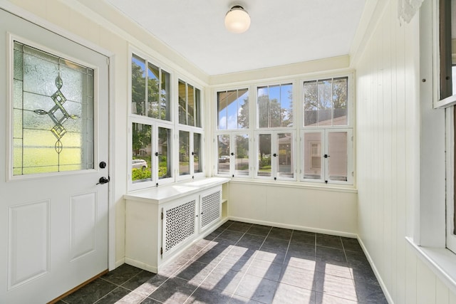 228 Sidney St W, Saint Paul, MN 55107 - unfurnished sunroom with french doors and baseboards